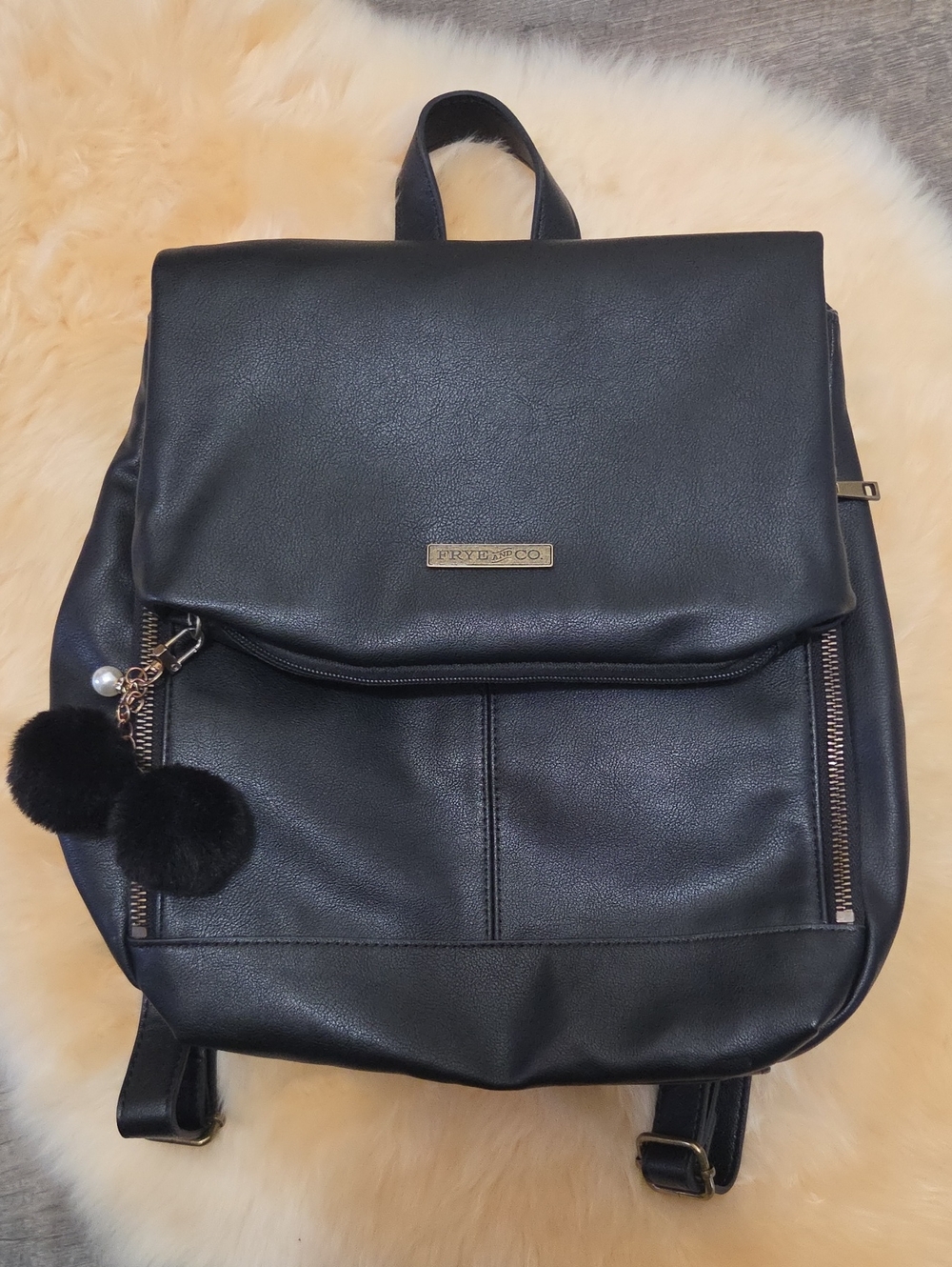 FRYE AND CO. Black Faux Leather Backpack with Pom-Pom Charm